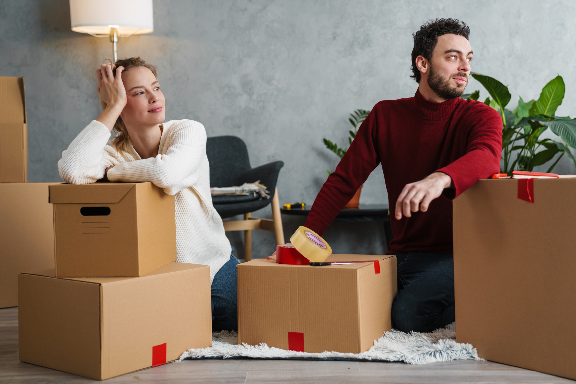 Happy young couple moving out